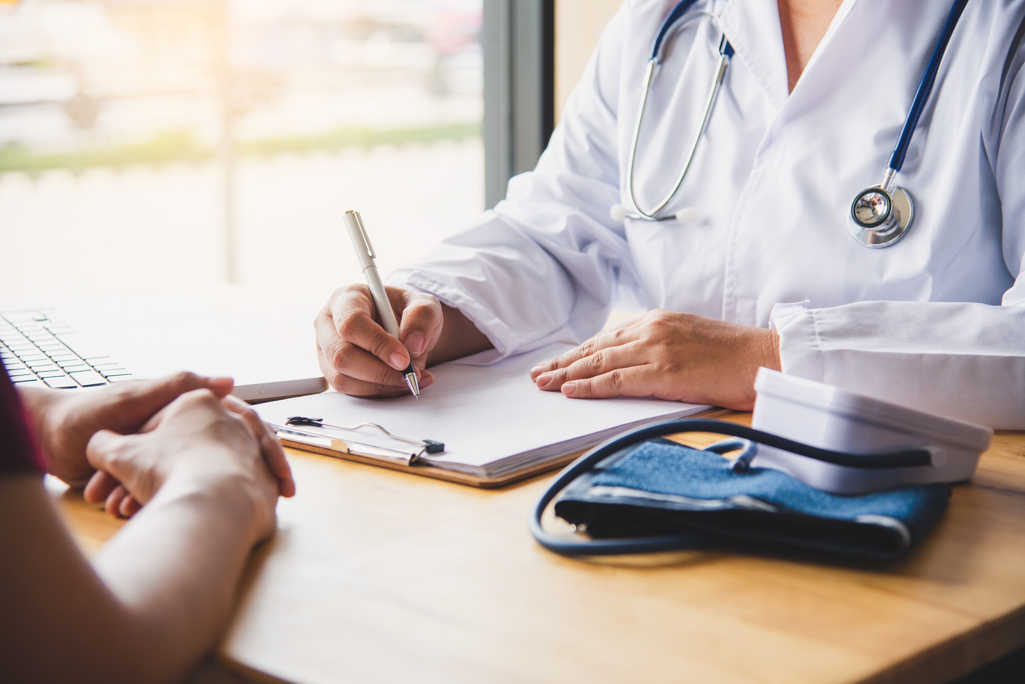 Doctors hands writing