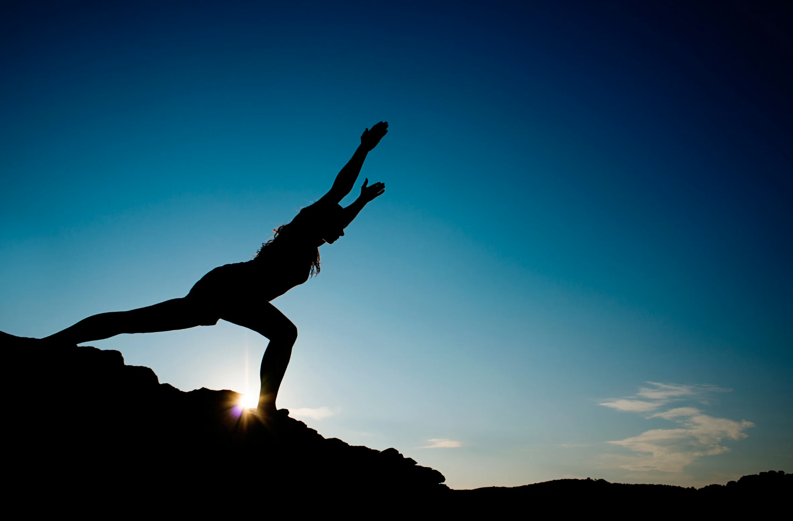 Woman stretching in horizon